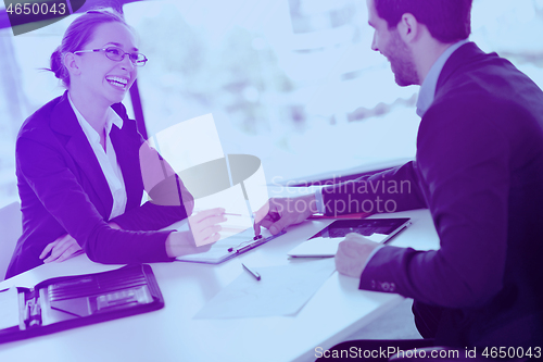 Image of business people in a meeting at office
