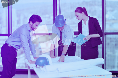 Image of business people and construction engineers on meeting