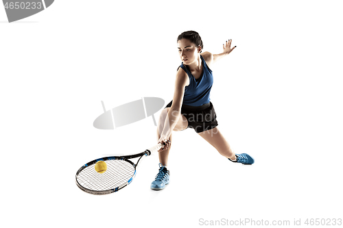 Image of Full length portrait of young woman playing tennis isolated on white background