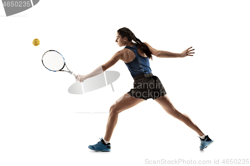 Image of Full length portrait of young woman playing tennis isolated on white background