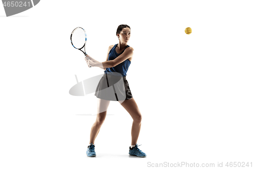 Image of Full length portrait of young woman playing tennis isolated on white background