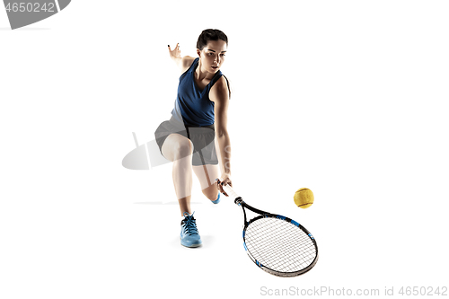 Image of Full length portrait of young woman playing tennis isolated on white background