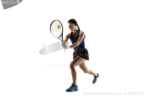 Image of Full length portrait of young woman playing tennis isolated on white background