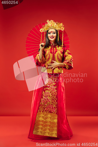 Image of Chinese traditional woman. Beautiful young girl wearing in national costume