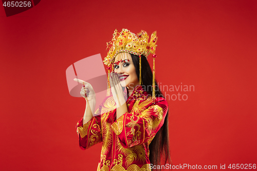 Image of Chinese traditional woman. Beautiful young girl wearing in national costume