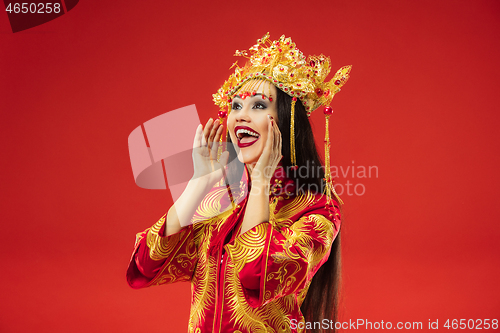 Image of Chinese traditional woman. Beautiful young girl wearing in national costume