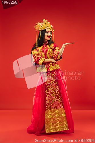 Image of Chinese traditional woman. Beautiful young girl wearing in national costume