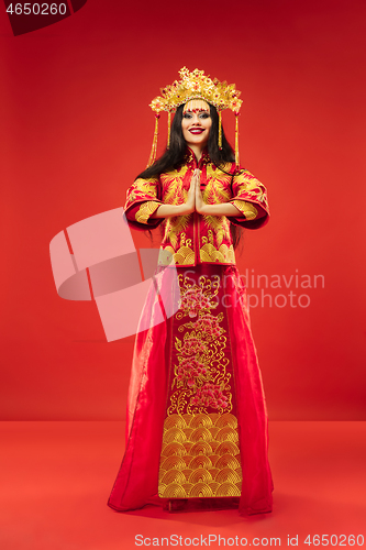 Image of Chinese traditional woman. Beautiful young girl wearing in national costume