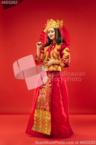 Image of Chinese traditional woman. Beautiful young girl wearing in national costume