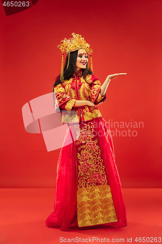 Image of Chinese traditional woman. Beautiful young girl wearing in national costume