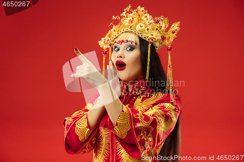 Image of Chinese traditional woman. Beautiful young girl wearing in national costume