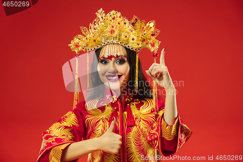 Image of Chinese traditional woman. Beautiful young girl wearing in national costume