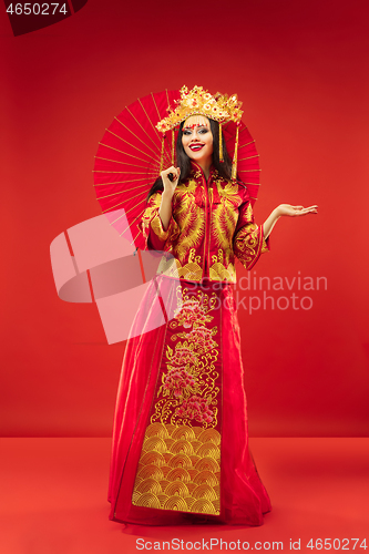 Image of Chinese traditional woman. Beautiful young girl wearing in national costume