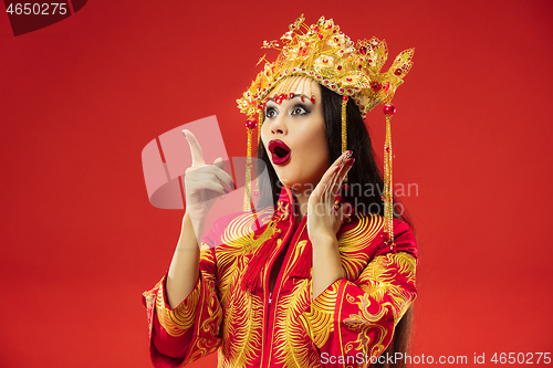 Image of Chinese traditional woman. Beautiful young girl wearing in national costume