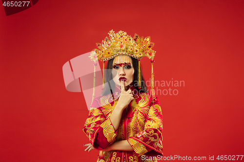 Image of Chinese traditional woman. Beautiful young girl wearing in national costume