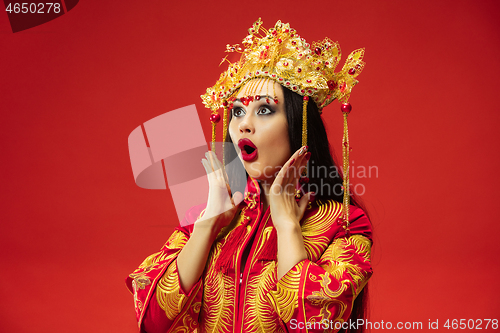 Image of Chinese traditional woman. Beautiful young girl wearing in national costume