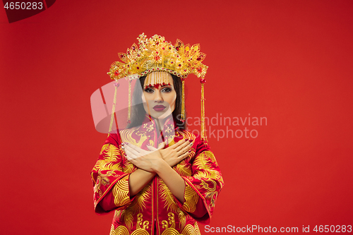 Image of Chinese traditional woman. Beautiful young girl wearing in national costume