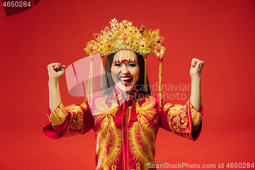 Image of Chinese traditional woman. Beautiful young girl wearing in national costume