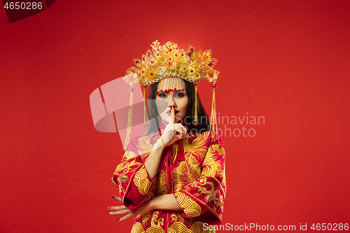 Image of Chinese traditional woman. Beautiful young girl wearing in national costume