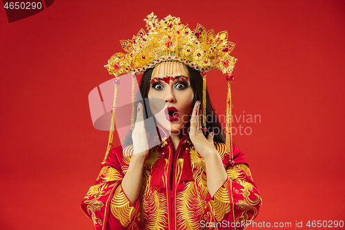 Image of Chinese traditional woman. Beautiful young girl wearing in national costume