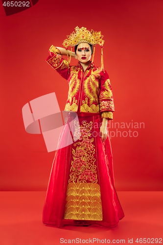 Image of Chinese traditional woman. Beautiful young girl wearing in national costume