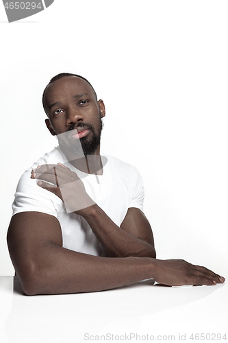 Image of Close up portrait of a young african man indoors