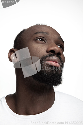 Image of Close up portrait of a young african man indoors