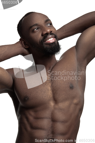 Image of Close up portrait of a young naked african man indoors