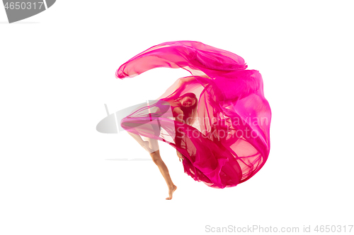 Image of Ballerina. Young graceful female ballet dancer dancing over white studio. Beauty of classic ballet.