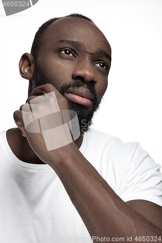 Image of Close up portrait of a young african man indoors