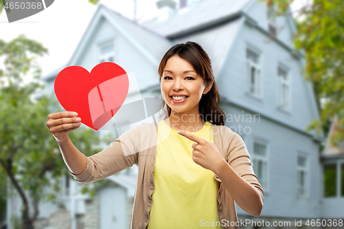 Image of happy asian woman with red heart