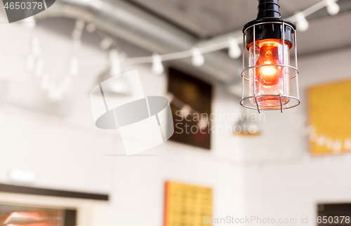Image of close up of lamp at modern restaurant