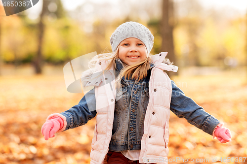 Image of happy girl at autumn park
