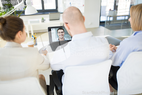 Image of business team having video conference at office