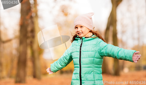 Image of happy girl at autumn park