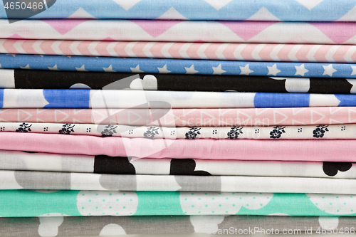 Image of Stack of cotton fabric material background