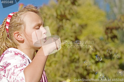 Image of girl blowing bubbles