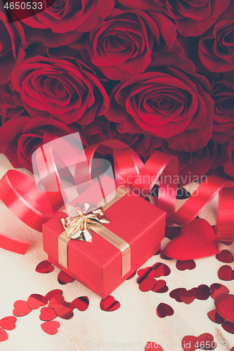 Image of Valentine gift and red roses, retro color tone