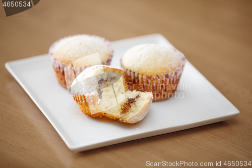 Image of fresh homemade Muffin on wooden table 