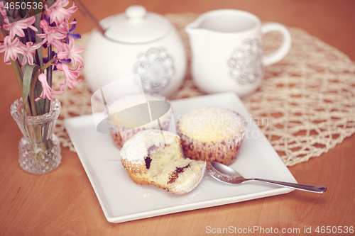 Image of fresh homemade Muffin on wooden table 