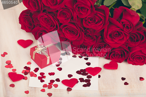 Image of small Valentine gift and red roses