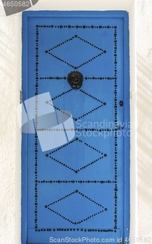 Image of Aged Blue door in Andalusian style from Sidi Bou Said