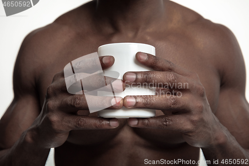 Image of African man with cup of tea, isolated on white background