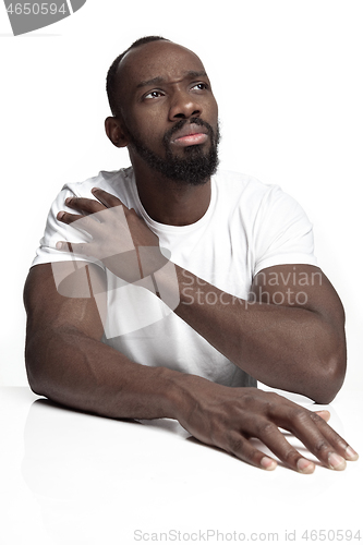 Image of Close up portrait of a young african man indoors