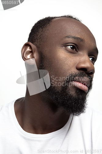 Image of Close up portrait of a young african man indoors