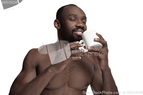 Image of African man with cup of tea, isolated on white background