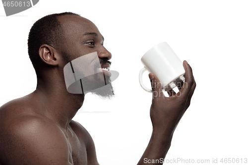 Image of African man with cup of tea, isolated on white background