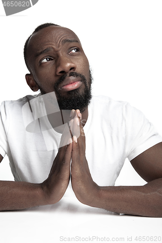 Image of Close up portrait of a young african man indoors