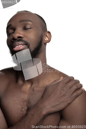 Image of Close up portrait of a young naked african man indoors