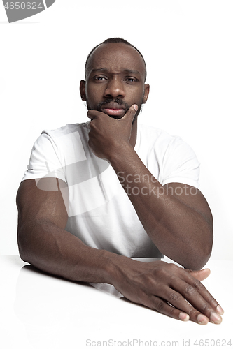 Image of Close up portrait of a young african man indoors